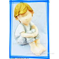 cute handmade Ceramic sitting boy figurine